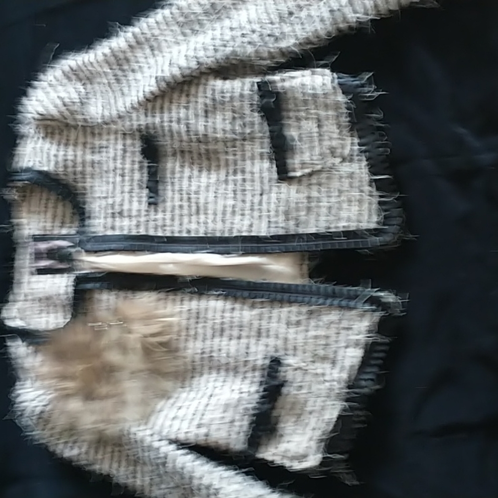 Jacket with rabbit and chain decoration.